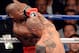 LAS VEGAS, NV - MAY 05: Miguel Cotto (R) hits Floyd Mayweather Jr. during the fifth round of their WBA super welterweight title fight at the MGM Grand Garden Arena May 5, 2012 in Las Vegas, Nevada. Mayweather won by unanimous decision. (Photo by Ethan Miller/Getty Images)