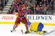 CALGARY, CANADA - JANUARY 5: Mikhail Grigorenko #17 of Team Russia digs for the puck under Mattias Backman #5 of Team Sweden during the 2012 World Junior Hockey Championship Gold Medal game at the Scotiabank Saddledome on January 5, 2012 in Calgary, Alberta, Canada. (Photo by Richard Wolowicz/Getty Images)