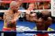 LAS VEGAS, NV - MAY 05: Miguel Cotto (L) hits Floyd Mayweather Jr. during the 12th round of their WBA super welterweight title fight at the MGM Grand Garden Arena May 5, 2012 in Las Vegas, Nevada. Mayweather won by unanimous decision. (Photo by Ethan Miller/Getty Images)