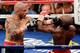 LAS VEGAS, NV - MAY 05: Miguel Cotto (L) hits Floyd Mayweather Jr. during the 12th round of their WBA super welterweight title fight at the MGM Grand Garden Arena May 5, 2012 in Las Vegas, Nevada. Mayweather won by unanimous decision. (Photo by Ethan Miller/Getty Images)