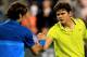 INDIAN WELLS, CA - MARCH 13: Roger Federer of Switzerland is congratulated by Milos Raonic of Canada after their match during the BNP Paribas Open at the Indian Wells Tennis Garden on March 13, 2012 in Indian Wells, California. (Photo by Matthew Stockman/Getty Images)