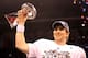INDIANAPOLIS, IN - FEBRUARY 05: Quarterback Eli Manning #10 of the New York Giants poses with the Vince Lombardi Trophy after the Giants defeated the Patriots by a score of 21-17 in Super Bowl XLVI at Lucas Oil Stadium on February 5, 2012 in Indianapolis, Indiana. (Photo by Ezra Shaw/Getty Images)