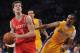 LOS ANGELES, CA - APRIL 06: Goran Dragic #3 of the Houston Rockets heads to the basket past Ramon Sessions #7 of the Los Angeles Lakers during a 112-107 Rockets win at Staples Center on April 6, 2012 in Los Angeles, California. NOTE TO USER: User expressly acknowledges and agrees that, by downloading and or using this photograph, User is consenting to the terms and conditions of the Getty Images License Agreement. (Photo by Harry How/Getty Images)
