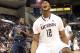 HARTFORD, CT - JANUARY 9: Andre Drummond #12 of the Connecticut Huskies reacts after scoring despite the defense of Jabarie Hinds #4 of the West Virginia Mountaineers at the XL Center on January 9, 2012 in Hartford, Connecticut. (Photo by Jim Rogash/Getty Images)