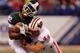 INDIANAPOLIS, IN - DECEMBER 03: Keshawn Martin #82 of the Michigan State Spartans loses his helmet as he is hit by Chris Borland #44 of the Wisconsin Badgers during the third quarter of the Big 10 Conference Championship Game at Lucas Oil Stadium on December 3, 2011 in Indianapolis, Indiana. (Photo by Gregory Shamus/Getty Images)
