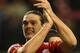 Andy Carroll applauds the fans at Anfield.