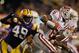 BATON ROUGE, LA - NOVEMBER 12: Kawaun Jakes #6 of the Western Kentucky Hilltoppers is tackled by Barkevious Mingo #49 of the Louisiana State University Tigers at Tiger Stadium on November 12, 2011 in Baton Rouge, Louisiana. The Tigers defeated the Hilltoppers 42-9. (Photo by Chris Graythen/Getty Images)