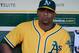 OAKLAND, CA - MAY 08: Yoenis Cespedes #52 of the Oakland Athletics was scratched from the line-up but looks on from the dugout before their game started against the Toronto Blue Jays at O.co Coliseum on May 8, 2012 in Oakland, California. (Photo by Thearon W. Henderson/Getty Images)