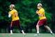 ASHBURN, VA - MAY 06: Robert Griffin III #10 and Kirk Cousins #12 of the Washington Redskins drop back to throw a pass during the Washington Redskins rookie minicamp on May 6, 2012 in Ashburn, Virginia. (Photo by Patrick McDermott/Getty Images)