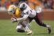 KNOXVILLE, TN - OCTOBER 29: DeAnthony Arnett #13 of the Tennessee Volunteers is tackled by Brison Williams #11 of the South Carolina Gamecocks at Neyland Stadium on October 29, 2011 in Knoxville, Tennessee. (Photo by Andy Lyons/Getty Images)