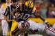 BATON ROUGE, LA - NOVEMBER 12: Russell Shepard #10 of the Louisiana State University Tigers is tackled by Kareem Peterson #14 of the Western Kentucky Hilltoppers at Tiger Stadium on November 12, 2011 in Baton Rouge, Louisiana. (Photo by Chris Graythen/Getty Images)