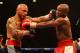 LAS VEGAS, NV - MAY 05: (L-R) Miguel Cotto and Floyd Mayweather Jr. exchange punches during their WBA super welterweight title fight at the MGM Grand Garden Arena on May 5, 2012 in Las Vegas, Nevada. (Photo by Al Bello/Getty Images)