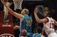 CHICAGO, IL - FEBRUARY 28: Chris Kaman #35 of the New Orleans Hornets puts up a shot past Joakim Noah #13 of the Chicago Bulls at the United Center on February 28, 2012 in Chicago, Illinois. NOTE TO USER: User expressly acknowledges and agrees that, by downloading and or using this photograph, User is consenting to the terms and conditions of the Getty Images License Agreement. (Photo by Jonathan Daniel/Getty Images)