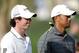 ABU DHABI, UNITED ARAB EMIRATES - JANUARY 28: Rory McIlroy of Northern Ireland and Tiger Woods of the USA during the third round of Abu Dhabi HSBC Golf Championship at the Abu Dhabi HSBC Golf Championship on January 28, 2012 in Abu Dhabi, United Arab Emirates. (Photo by Ross Kinnaird/Getty Images)
