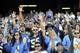 SAN DIEGO, CA - MAY 11: Fans reach out during a public memorial for former San Diego Chargers star football player Junior Seau at Qualcomm Stadium May 11, 2012 in San Diego, California. Seau was found shot to death at his home in what police say was a suicide. (Photo by Denis Poroy/Getty Images)