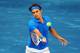 MADRID, SPAIN - MAY 12: Roger Federer of Switzerland plays a backhand to Janko Tipsarevic of Serbia in his semi final match during the Mutua Madrilena Madrid Open tennis tournament at the Caja Magica on May 12, 2012 in Madrid, Spain. (Photo by Jasper Juinen/Getty Images)