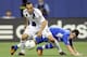 MONTREAL, CANADA - MAY 12: Landon Donovan #10 of the Los Angeles Galaxy takes the ball from Felipe Martins #7 of the Montreal Impact during the MLS match at the Olympic Stadium on May 12, 2012 in Montreal, Quebec, Canada. The game ended in a 1-1 tie. (Photo by Richard Wolowicz/Getty Images)