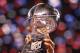 INDIANAPOLIS, IN - FEBRUARY 05: Members of the New York Giants pose with the Vince Lombardi Trophy after the Giants defeated the Patriots by a score of 21-17 in Super Bowl XLVI at Lucas Oil Stadium on February 5, 2012 in Indianapolis, Indiana. (Photo by Ezra Shaw/Getty Images)