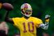 ASHBURN, VA - MAY 06: Robert Griffin III #10 of the Washington Redskins practices during the Washington Redskins rookie minicamp on May 6, 2012 in Ashburn, Virginia. (Photo by Patrick McDermott/Getty Images)