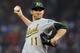 BOSTON, MA - MAY 1: Jarrod Parker #11 of the Oakland Athletics throws against the Oakland Athletics at Fenway Park May 1, 2012 in Boston, Massachusetts. (Photo by Jim Rogash/Getty Images)
