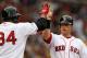 BOSTON, MA - MAY 15: Daniel Nava #66 of the Boston Red Sox is congratulated by teammate David Ortiz #34 after Nava scored in the fourth inning against the Seattle Mariners on May 15, 2012 at Fenway Park in Boston, Massachusetts. (Photo by Elsa/Getty Images)