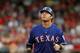 ARLINGTON, TX - MAY 14: Josh Hamilton #32 of the Texas Rangers watches a pop fly while rounding second base against the Kansas City Royals on May 14, 2012 in Arlington, Texas. (Photo by Layne Murdoch/Getty Images)