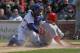 CHICAGO, IL - APRIL 22: Jay Bruce #32 of the Cincinnati Reds is tagged out on a squeeze play by Geovany Soto #18 of the Chicago Cubs at Wrigley Field on April 22, 2012 in Chicago, Illinois. (Photo by Jonathan Daniel/Getty Images)