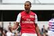 LONDON, ENGLAND - MARCH 31: Theo Walcott of Arsenal celebrates scoring his side's equalising goal during the Barclays Premier League match between Queens Park Rangers and Arsenal at Loftus Road on March 31, 2012 in London, England. (Photo by Ian Walton/Getty Images)
