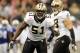 NEW ORLEANS, LA - OCTOBER 23: Jonathan Vilma #51 of the New Orleans Saints calls a defensive play during a game against the Indianapolis Colts being held at Mercedes-Benz Superdome on October 23, 2011 in New Orleans, Louisiana. The Saints defeated the Colts 62-7. (Photo by Stacy Revere/Getty Images)
