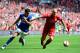 LONDON, ENGLAND - APRIL 14: Martin Skrtel of Liverpool holds off Tim Cahill of Everton during the FA Cup with Budweiser Semi Final match between Liverpool and Everton at Wembley Stadium on April 14, 2012 in London, England. (Photo by Shaun Botterill/Getty Images)