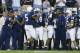 ORCHARD PARK, NY - SEPTEMBER 14: Larry Johnson #5 of Penn State celebrates scoring Penn State's first touchdown against Nebraska with teammates Ricky Upton #44 and Bryant Johnson #24 during their NCAA football game on September 14, 2002 at Beaver Stadium in State College, Pennsylvania. Penn State defeated Nebraska 40-7. (Photo by Rick Stewart/Getty Images)