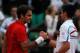 PARIS, FRANCE - JUNE 03: Roger Federer of Switzerland is congratulated by Novak Djokovic of Serbia following his victory during the men's singles semi final match between Roger Federer of Switzerland and Novak Djokovic of Serbia on day thirteen of the French Open at Roland Garros on June 3, 2011 in Paris, France. (Photo by Matthew Stockman/Getty Images)