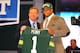 NEW YORK, NY - APRIL 26: Nick Perry (R) from USC holds up a jersey as he stands on stage with NFL Commissioner Roger Goodell after he was selected #28 overall by the Green Bay Packers in the first round of the 2012 NFL Draft at Radio City Music Hall on April 26, 2012 in New York City. (Photo by Al Bello/Getty Images)