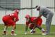 KANSAS CITY, MO - MAY 13: Ethan Johnson #70 and Dontari Poe #92 of the Kansas City Chiefs work with defensive coach Anthony Pleasant during the Kansas City Chiefs minicamp on May 13, 2012 at the Chiefs Training Facility in Kansas City, Missouri. (Photo by Kyle Rivas/Getty Images)