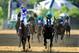 BALTIMORE, MD - MAY 19: I'll Have Another ridden by Mario Gutierrez (L) beats Bodemeister ridden by Mike E. Smith at the finish line to win the 137th running of the Preakness Stakes at Pimlico Race Course on May 19, 2012 in Baltimore, Maryland. (Photo by Patrick Smith/Getty Images)