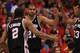 LOS ANGELES, CA - MAY 19: Tim Duncan #21 of the San Antonio Spurs celebrates with Kawhi Loenard #2 and Boris Diaw #33 after making a basket and picking up a foul against the Los Angeles Clippers in Game Three of the Western Conference Semifinals in the 2012 NBA Playoffs on May 19, 2011 at Staples Center in Los Angeles, California. The Spurs won 96-86 to take a three games to none lead in the series. NOTE TO USER: User expressly acknowledges and agrees that, by downloading and or using this photograph, User is consenting to the terms and conditions of the Getty Images License Agreement. (Photo by Stephen Dunn/Getty Images)