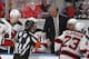 SUNRISE, FL - APRIL 21: Referee Wes McCauley #4 talks to head coach Peter DeBoer of the New Jersey Devils during a break in action against the Florida Panthers in Game Five of the Eastern Conference Quarterfinals during the 2012 NHL Stanley Cup Playoffs at the BankAtlantic Center on April 21, 2012 in Sunrise, Florida. The Panthers defeated the Devils 3-0. (Photo by Joel Auerbach/Getty Images)