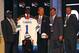 NEW YORK, NY - APRIL 26: Morris Claiborne from LSU stands on stage with family and friends including his son Morris Jr. and LSU head coach Les Miles (C) after Claiborne was selected #6 overall by the Dallas Cowboys during the 2012 NFL Draft at Radio City Music Hall on April 26, 2012 in New York City. (Photo by Al Bello/Getty Images)