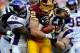 LANDOVER, MD - DECEMBER 24: Tight end Logan Paulsen #82 of the Washington Redskins is pulled down by linebacker E.J. Henderson #56 of the Minnesota Vikings and linebacker Chad Greenway #52 of the Minnesota Vikings in the fourth quarter at FedEx Field on December 24, 2011 in Landover, Maryland. The Minnesota Vikings won, 33-26. (Photo by Patrick Smith/Getty Images)
