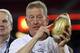 GLENDALE, AZ - JANUARY 02: Interim head coach Bill Stewart of the West Virginia Mountaineers holds up the Fiesta Bowl trophy after the Mountaineers 48-28 victory against the Oklahoma Sooners at the Tostito's Fiesta Bowl at University of Phoenix Stadium January 2, 2008 in Glendale, Arizona. (Photo by Stephen Dunn/Getty Images)