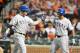 BALTIMORE, MD - MAY 8: Josh Hamilton #10 of the Texas Rangers celebrates with Adrian Beltre #29 hitting a two-run home run in the third inning during a baseball game against the Baltimore Orioles at Oriole Park at Camden Yards on May 8, 2012 in Baltimore, Maryland. (Photo by Mitchell Layton/Getty Images)