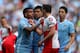 MANCHESTER, ENGLAND - MAY 13: Carlos Tevez of Manchester City clashes with Joey Barton of QPR after being fouled during the Barclays Premier League match between Manchester City and Queens Park Rangers at the Etihad Stadium on May 13, 2012 in Manchester, England. (Photo by Alex Livesey/Getty Images)