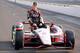 INDIANAPOLIS, IN - MAY 20: Ryan Briscoe the pole sitter for the Indianpolis 500 and driver of the IZOD Team Penske car poses on the track at Indianapolis Motor Speedway on May 20, 2012 in Indianapolis, Indiana. (Photo by Andy Lyons/Getty Images)