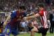 MADRID, SPAIN - MAY 25: Lionel Messi of Barcelona duels for the ball with Oscar de Marcos of Athletic Bilbao during the Copa del Rey Final match between Athletic Bilbao and Barcelona at Vicente Calderon Stadium on May 25, 2012 in Madrid, Spain. (Photo by Angel Martinez/Getty Images)