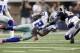ARLINGTON, TX - OCTOBER 23: Cornerback Mike Jenkins #21of the Dallas Cowboys intercepts a pass against Brandon Lloyd #83 of the St. Louis Rams at Cowboys Stadium on October 23, 2011 in Arlington, Texas. (Photo by Layne Murdoch/Getty Images)