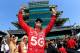 INDIANAPOLIS, IN - MAY 27: Dario Franchitti of Scotland, driver of the #50 Target Chip Ganassi Racing Honda celebrates as his wife actress Ashley Judd (L) and Susie Wheldon (2nd L), wife of the late Dan Wheldon look on during the IZOD IndyCar Series 96th running of the Indianapolis 500 mile race at the Indianapolis Motor Speedway on May 27, 2012 in Indianapolis, Indiana. (Photo by Chris Trotman/Getty Images)