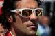 INDIANAPOLIS, IN - MAY 27: Dario Franchitti of Scotland, driver of the #50 Target Chip Ganassi Racing Honda looks on prior to the start of the IZOD IndyCar Series 96th running of the Indianapolis 500 mile race at the Indianapolis Motor Speedway on May 27, 2012 in Indianapolis, Indiana. (Photo by Chris Trotman/Getty Images)