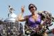 INDIANAPOLIS, IN - MAY 28: Dario Franchitti of Scotland, driver of the #50 Target Chip Ganassi Racing Honda, watches on as his wife, Ashley Judd, poses with the Borg Warner Trophy on the yard of bricks during the Indianapolis 500 Mile Race Trophy Presentation at Indianapolis Motor Speedway on May 28, 2012 in Indianapolis, Indiana. (Photo by Nick Laham/Getty Images)