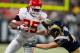 ST. LOUIS, MO - DECEMBER 19: Jamaal Charles #25 of the Kansas City Chiefs looks to get by Craig Dahl #43 of the St. Louis Rams at the Edward Jones Dome on December 19, 2010 in St. Louis, Missouri. The Chiefs beat the Rams 27-13. (Photo by Dilip Vishwanat/Getty Images)