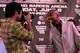 BEVERLY HILLS, CA - FEBRUARY 21: Manny Pacquiao (L) uses a photographer's camera to take a shot of Timothy Bradley at a press conference announcing their upcoming World Boxing Organization welterweight championship fight at The Beverly Hills Hotel on February 21, 2012 in Beverly Hills, California. (Photo by Stephen Dunn/Getty Images)